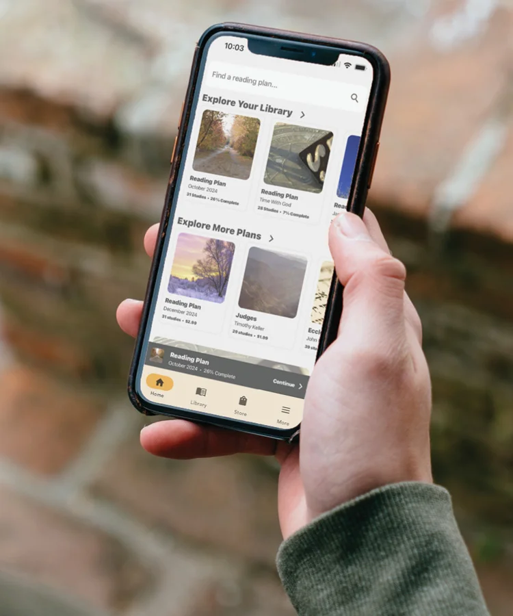 Photograph of someone using the Explore app on his or her phone