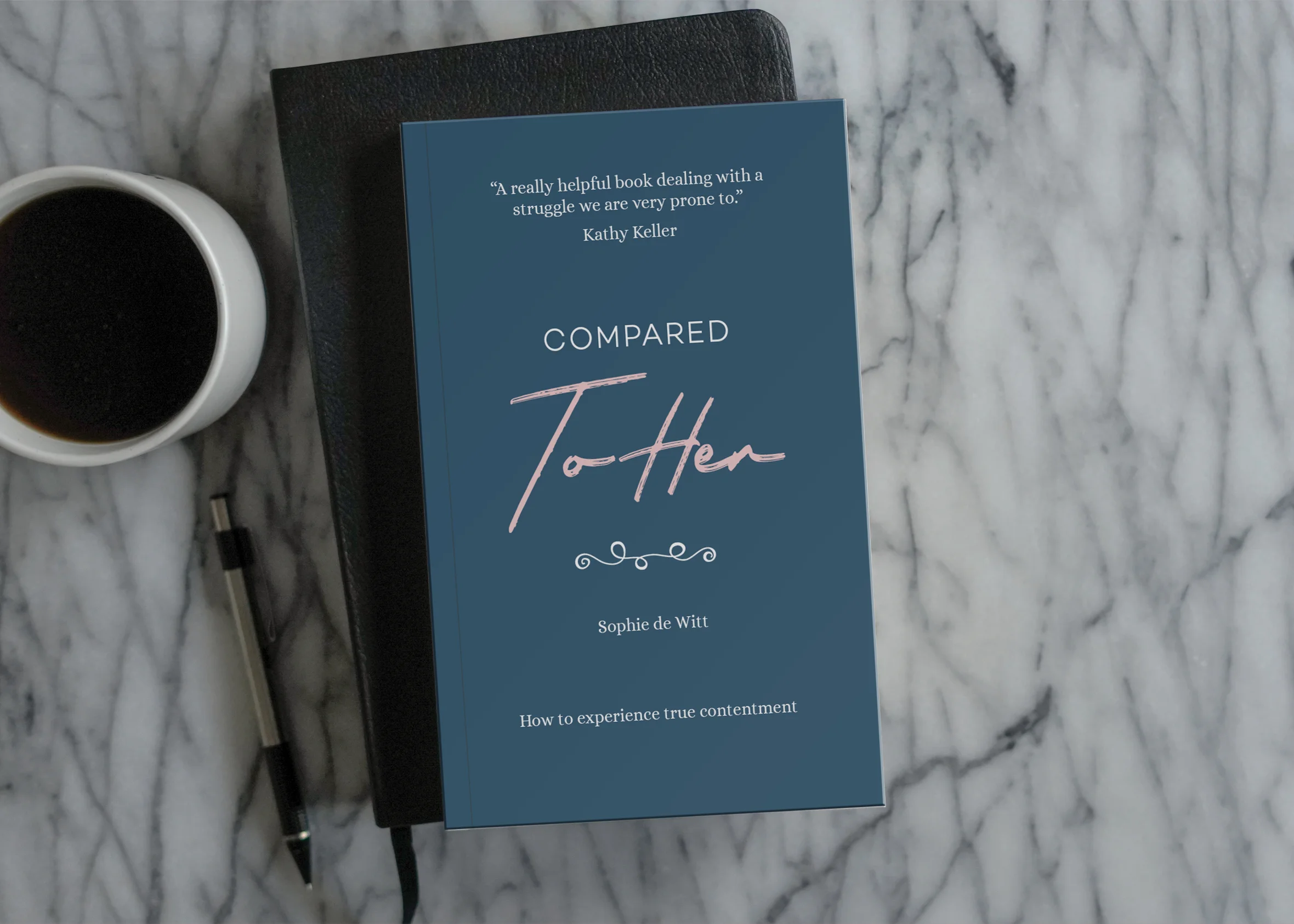 Photograph of Compared to Her on a marble tabletop with a bible and a coffee