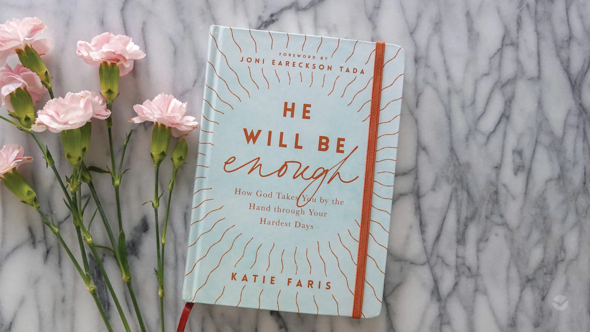 Photograph of He Will Be Enough on a marble background with flowers