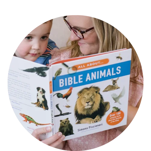 Photograph of a woman reading to a small boy All About Bible Animals