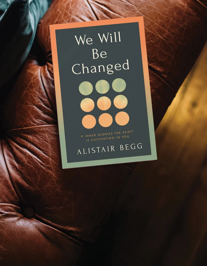 We Will Be Changed by Alistair Begg on a leather chair arm